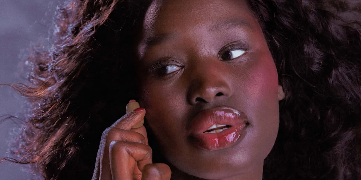 model holding a mini pocket blush