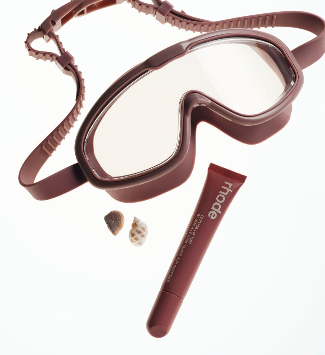 peptide lip tint salty tan and mauve goggles and shells